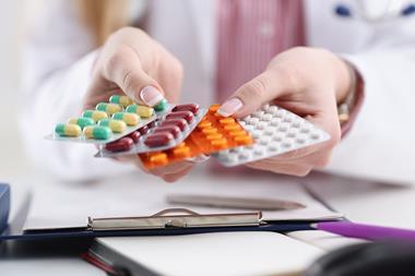 Doctor holding pills