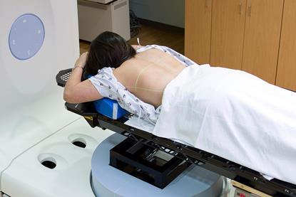 Woman receiving radiotherapy treatment for lung cancer